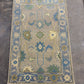 Decorative rug with floral patterns on a concrete floor