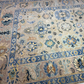 Close-up of a patterned rug with floral and geometric designs.