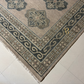 Close-up of a patterned rug on a tiled floor