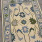 Decorative rug with floral patterns on a neutral background