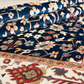 Close-up of a patterned rug with intricate designs.