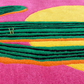Colorful abstract rug with geometric patterns on a pink background