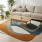 Living room with a beige sofa, wooden coffee table, and a colorful rug.