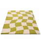 Green and beige checkered patterned rug on a white background