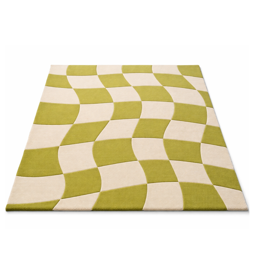 Green and beige checkered patterned rug on a white background