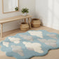 Light blue rug with cloud patterns on a wooden floor, with a wooden bench and plants in the background.