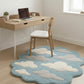 Cloud-patterned rug on a wooden floor with a desk and chair in the background.