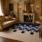 A large area rug with a cream background and a pattern of dark blue and white circles, styled in a luxurious, ornate room with gold furniture and a fireplace.