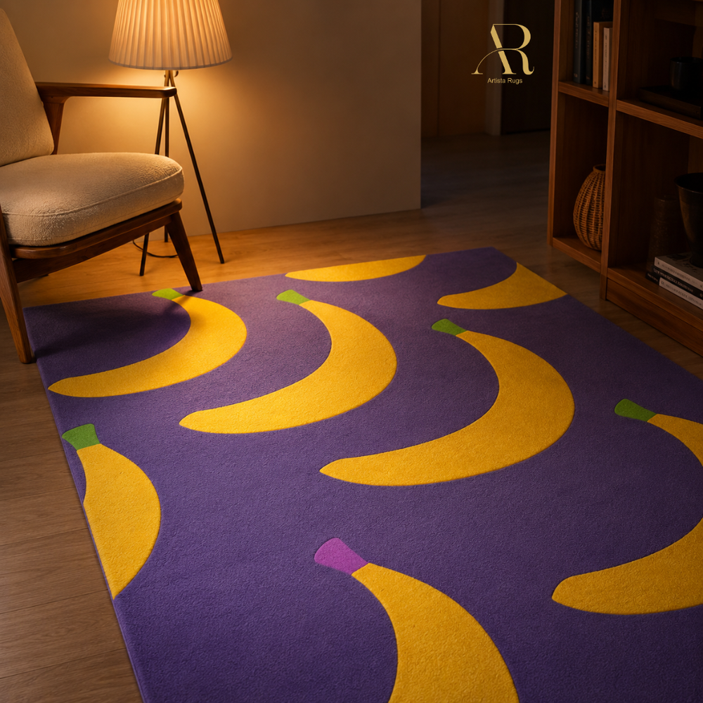 A purple area rug with a bold yellow banana pattern, styled in a warm, modern living room setting next to a wooden chair and bookshelf.