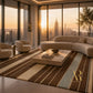 A luxury living room featuring a large striped area rug in shades of brown, beige, and muted blue-gray, styled with a stone coffee table and modern curved seating. The room is set in a high-rise apartment with a city skyline and sunset view, and features the 'Arts & Roots' brand logo in the bottom right corner.