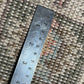Ruler on a textured carpet surface