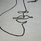 Abstract line art of a face on a gray background
