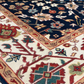 Close-up of a colorful patterned rug with intricate designs.