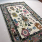 Decorative rug with floral patterns on a plain background