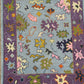 Colorful patterned rug with floral designs on a blue background