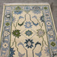 Decorative rug with floral patterns on a plain background