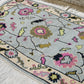 Decorative rug with floral patterns on a neutral background