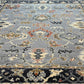 Close-up of a patterned rug with intricate designs on a blue background