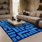 A modern living room featuring a large area rug with a bold blue and navy geometric maze-like pattern, styled with a beige sectional sofa, a low wooden coffee table, and neutral decor.