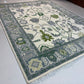 Decorative rug with intricate patterns on a white floor