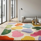 Colorful abstract rug on a wooden floor with a modern living room setting.