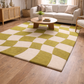 Living room with a green and beige checkered rug, white sofa, and wooden coffee table.