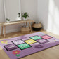 Colorful children's rug with numbers and letters on a wooden floor.
