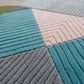 Multicolored textured rug with geometric patterns