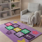 Children's play rug with numbers and shapes on a wooden floor in a room with a bookshelf and chair.