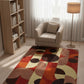 Living room with a patterned rug, bookshelf, and armchair.