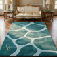 Teal patterned rug in a room with a beige sofa and side tables.