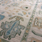 Close-up of a patterned rug with geometric designs in earthy tones.