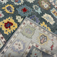 Close-up of patterned rugs with colorful floral designs on a blue background.