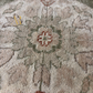 Close-up of a textured rug with floral patterns
