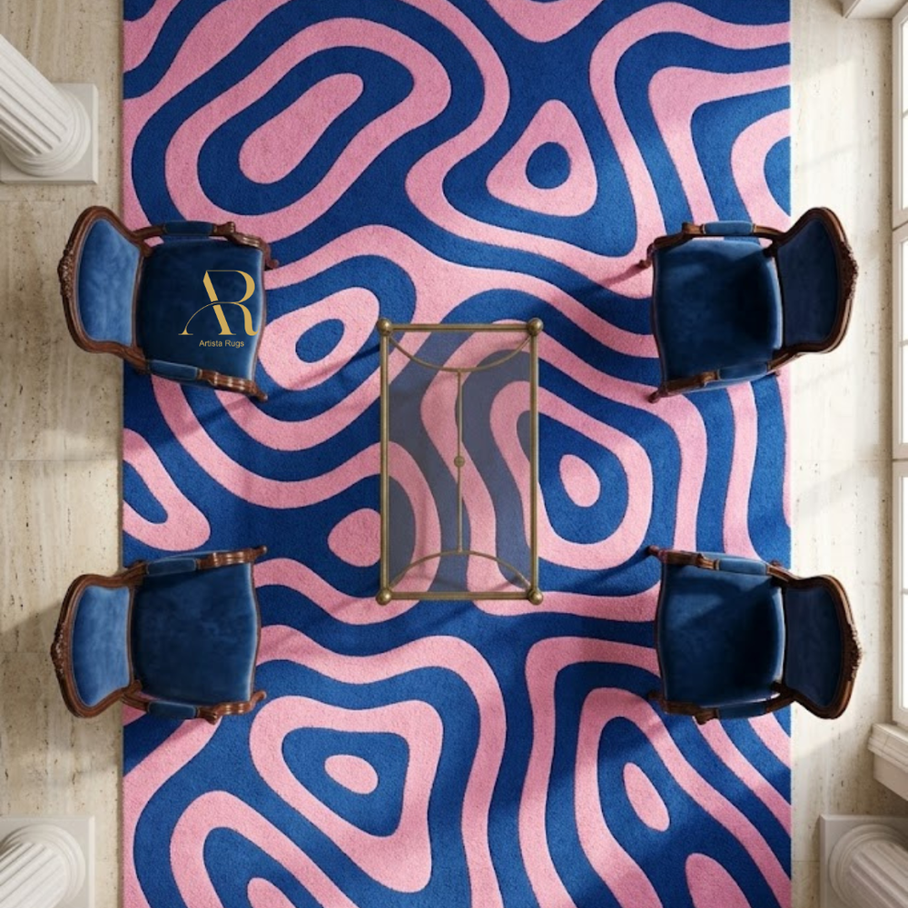 Pink and blue wavy patterned rug with four blue chairs and a small table.