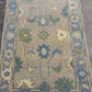 Decorative rug with floral patterns on a gray background