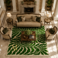 An overhead view of a luxurious living room featuring a large green and cream wavy patterned area rug under a matching beige sofa, two armchairs, and a wooden coffee table.