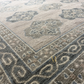Close-up of a textured rug with geometric pattern