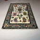 Decorative rug with floral patterns on a white floor