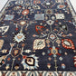 Decorative rug with intricate patterns on a blue background