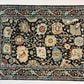 Decorative rug with intricate patterns on a black background