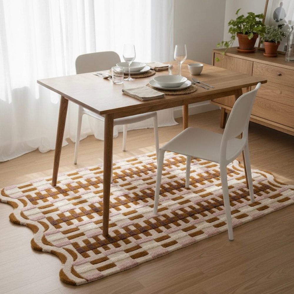 Dining table with chairs on a patterned rug in a room with light curtains and wooden furniture.