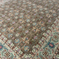 Close-up of a patterned rug with intricate designs.