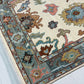 Decorative rug with intricate patterns on a light gray floor