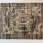 Patterned rug with abstract design on a plain background