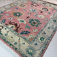 Decorative rug with intricate patterns on a light-colored floor