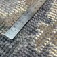 Metal ruler on a textured surface