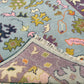 Close-up of a colorful patterned rug with floral designs.