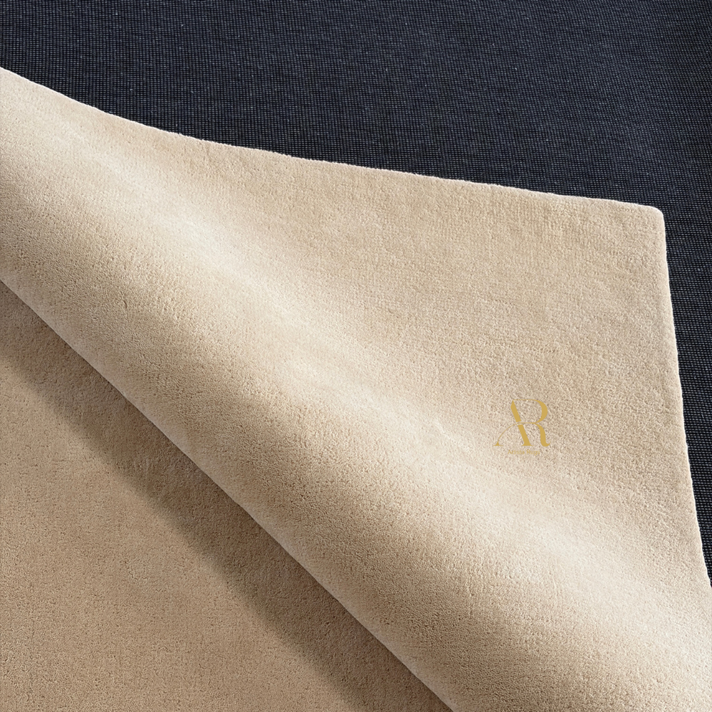 Beige fabric with a gold logo on a dark background
