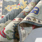 Close-up of patterned rugs with colorful designs on a neutral background